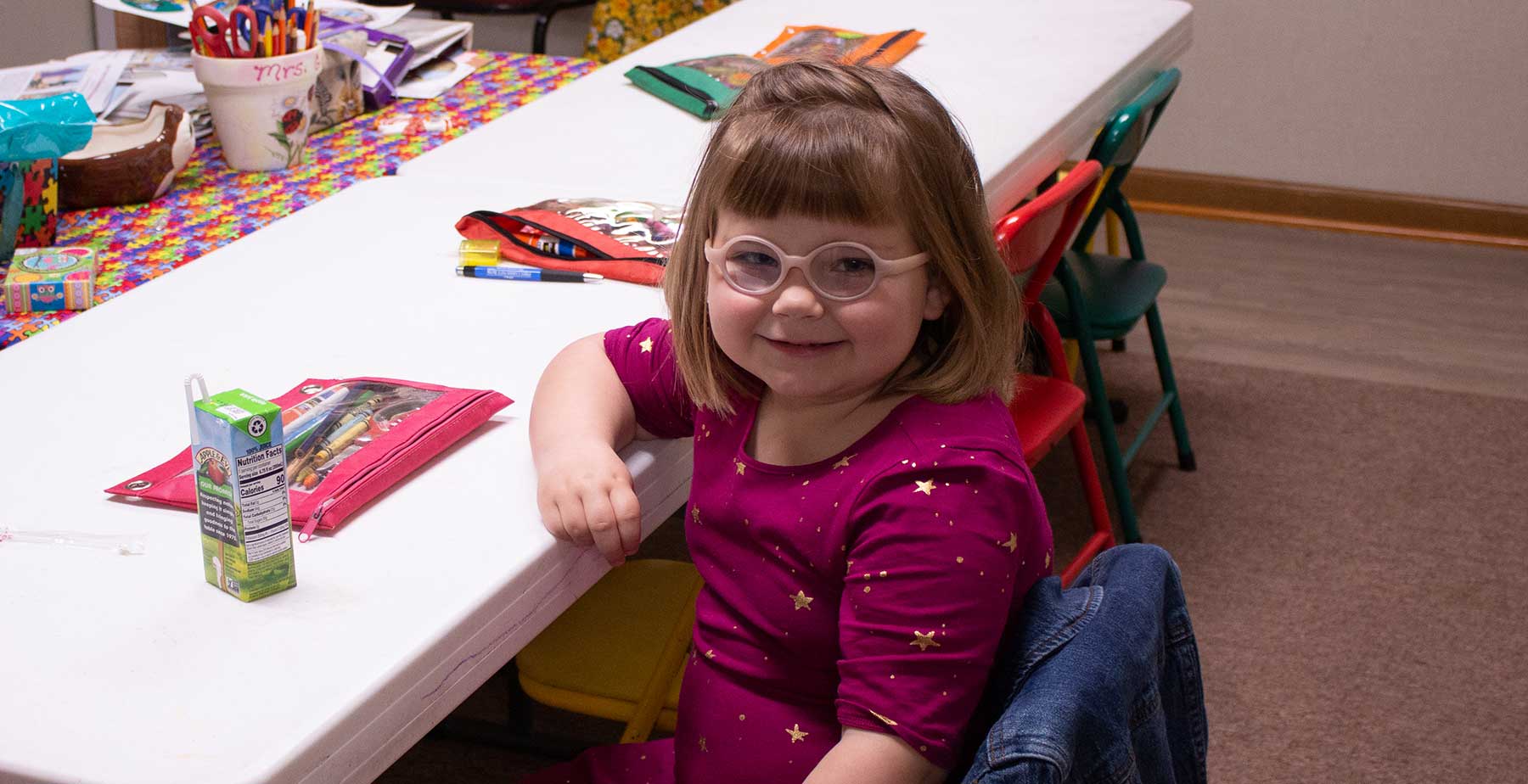 Little girl with glasses in Sunday School