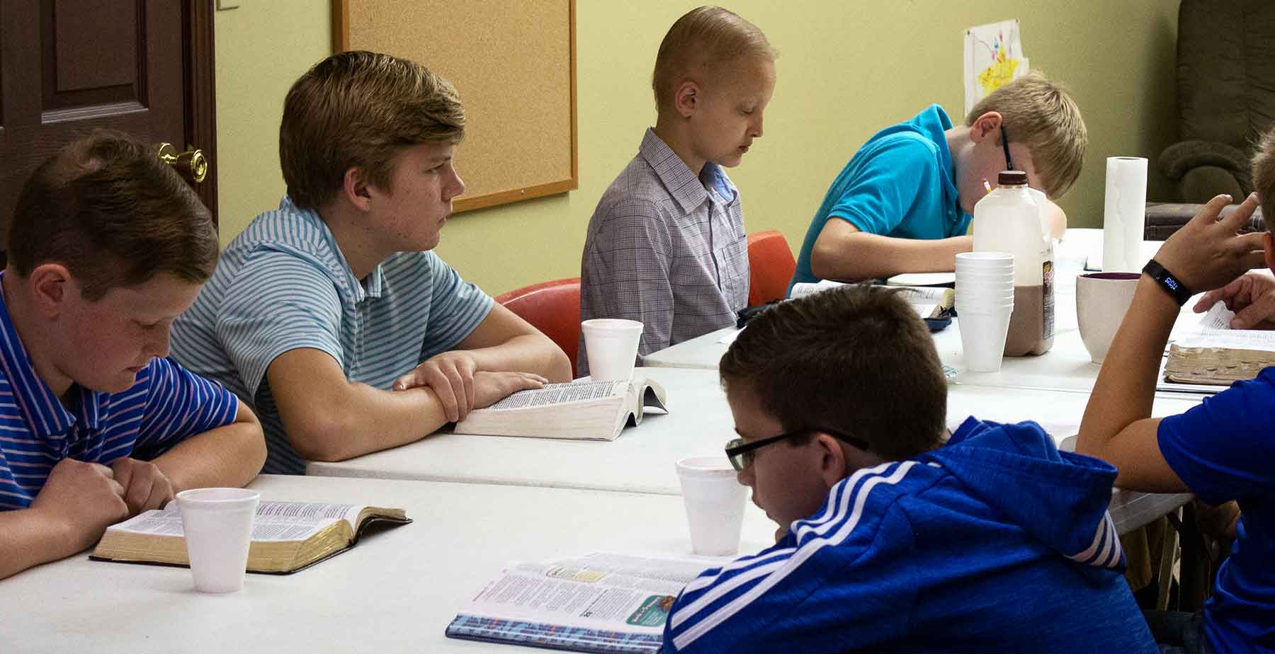 A photo of preteen Boys in a bible study